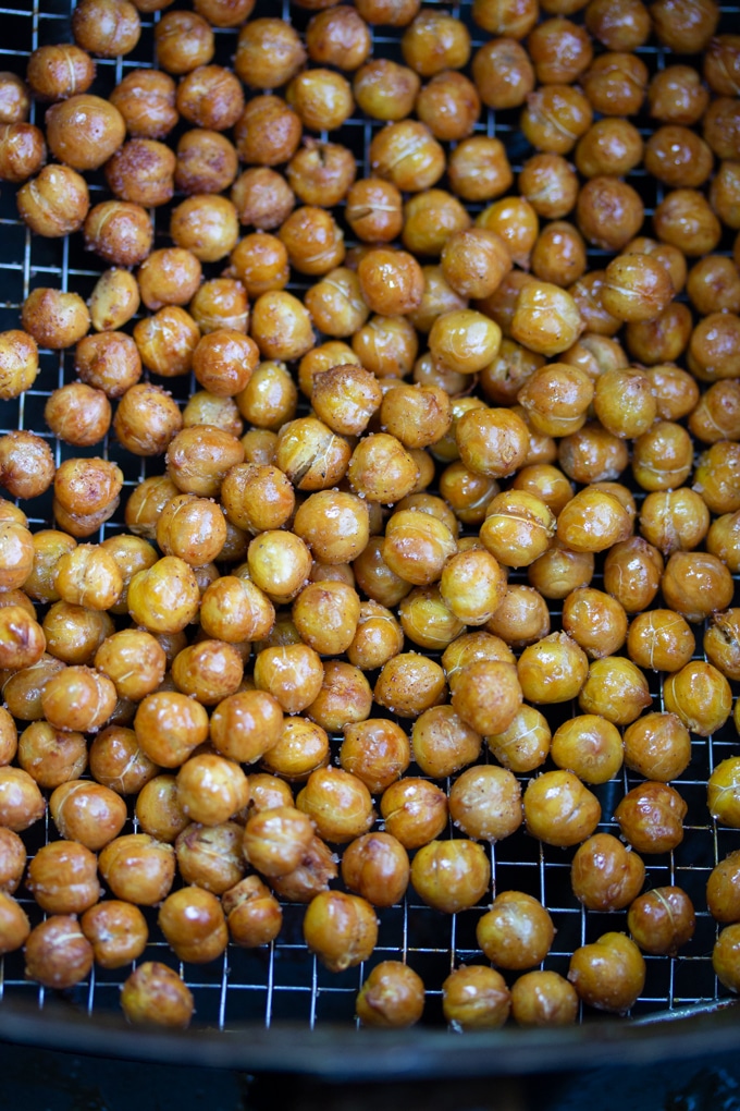 air fryer chickpeas in air fryer basket cooked and seasoned