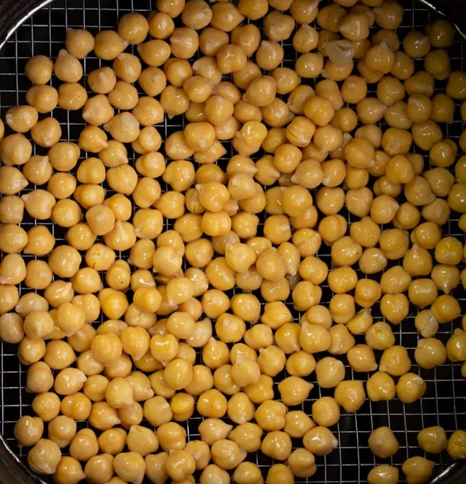 drained chickpeas in air fryer basket