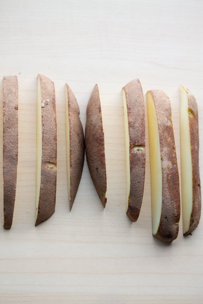 a russet potato cut into wedges