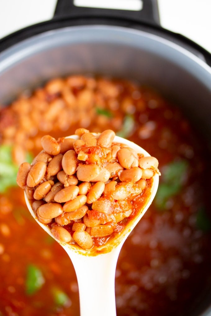 instant pot pinto beans on a spoon