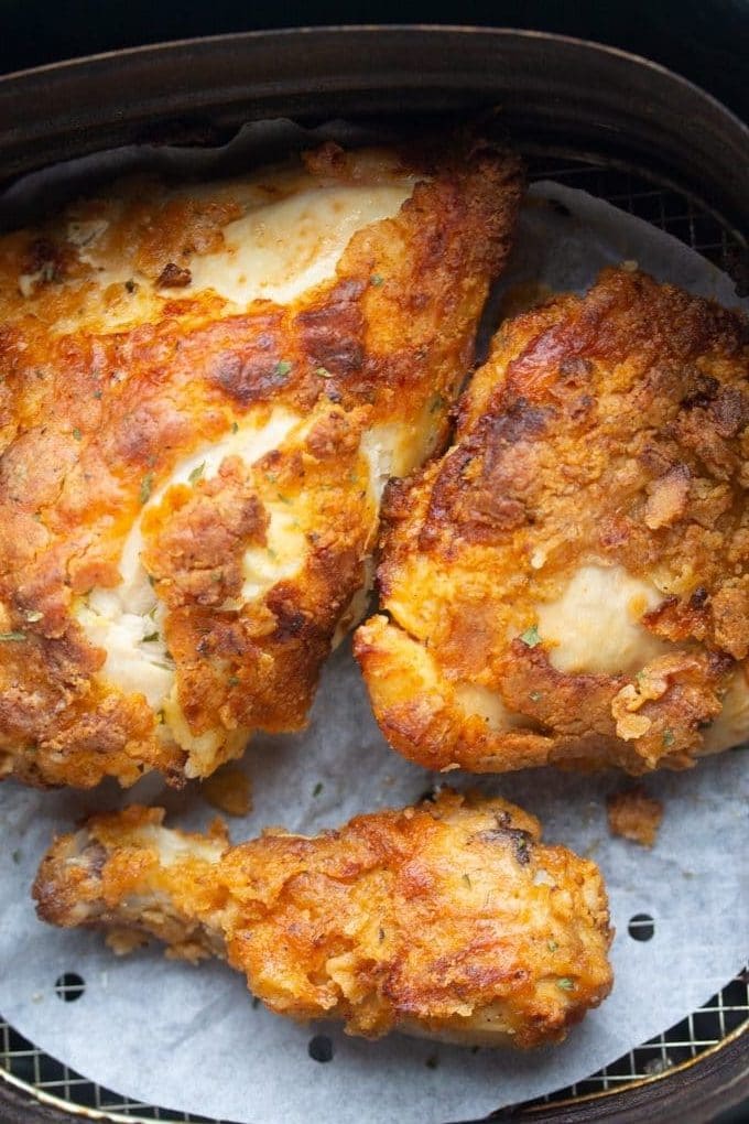 fried chicen in an air fryer basket