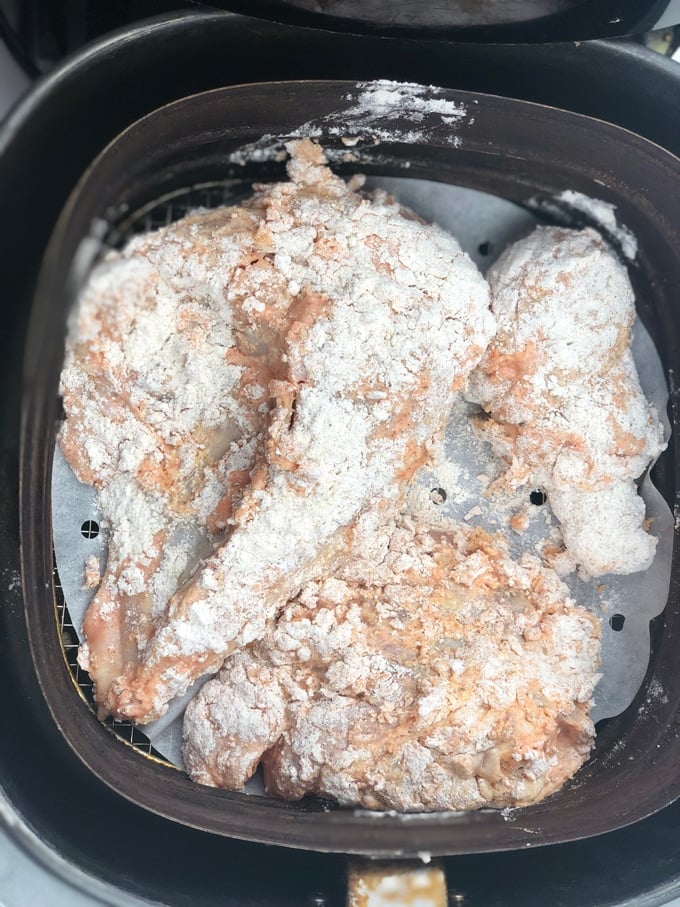 chicken pieces covered in flour in Air Fryer