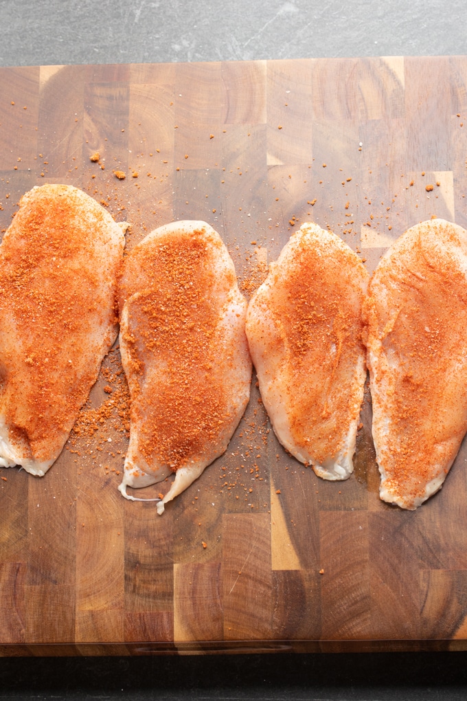 raw chicken with bbq seasoning on it