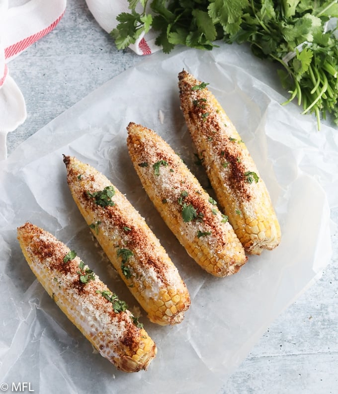 air fried mexican street corn on a blue background 