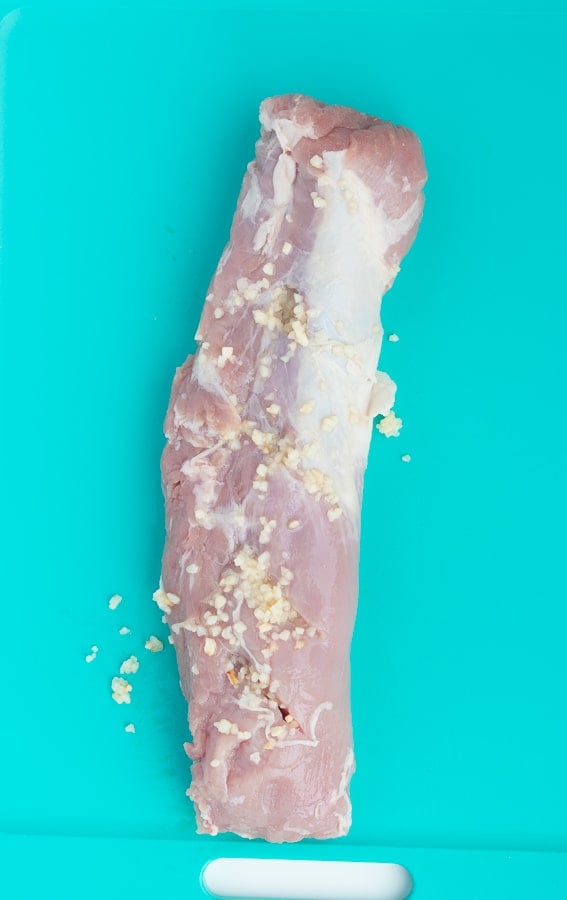 raw pork tenderloin stuffed with minced garlic