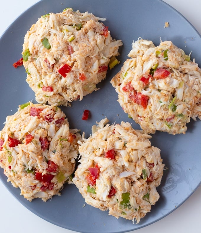 crab cakes on a plateEasy and delicious crab cakes that are made in the Air Fryer with less mess and less stress. Nice crust on the inside with flakey and flavorful crab meat on the inside. #airfryerrecipes #airfryermeals #airfryerappetizers #crabcake