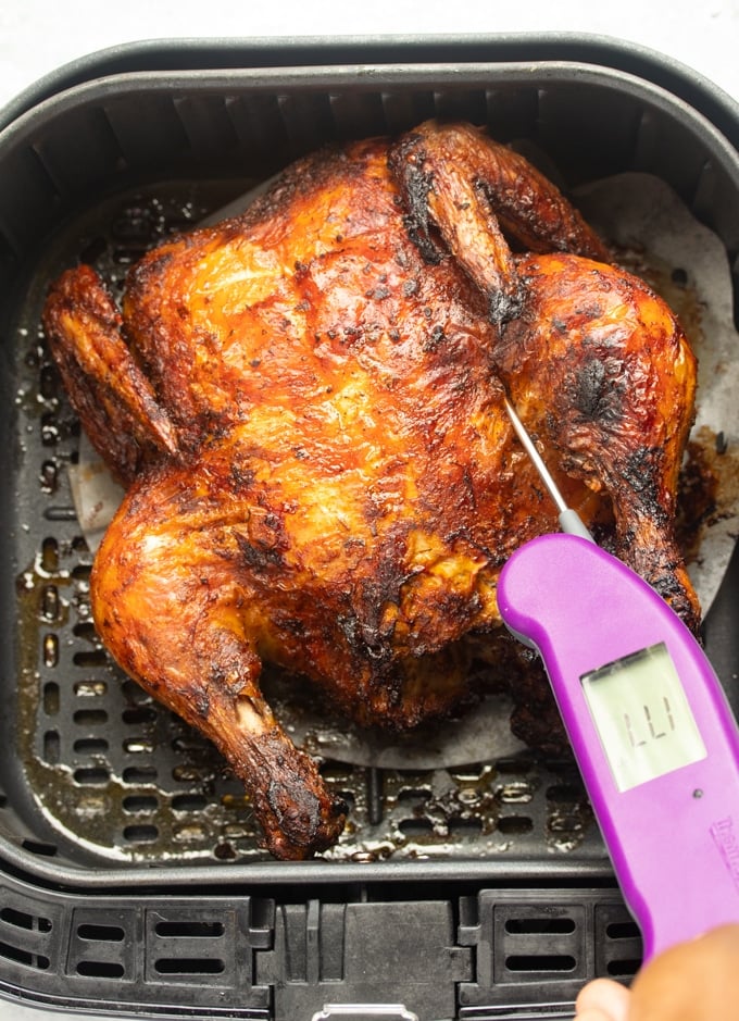 air fryer whole chicken with thermometer in chicken