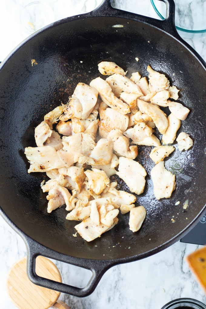 chicken pieces in a wok