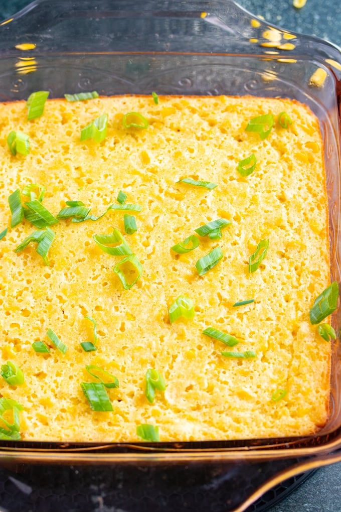 baked corn souffle with green onions scattered on top