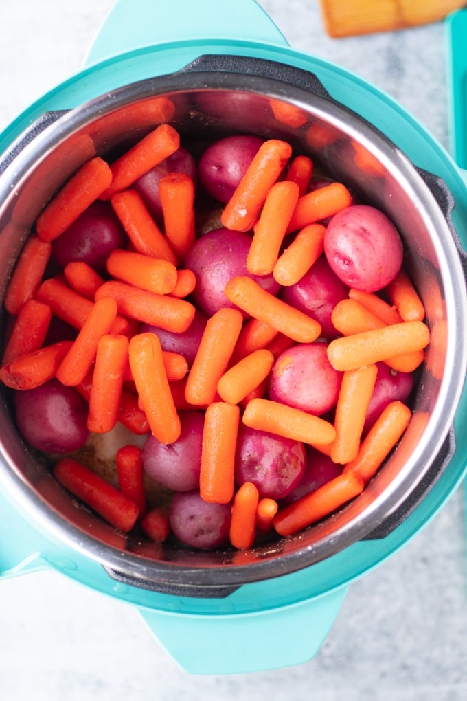 red potatoes and carrots in pressure cooker