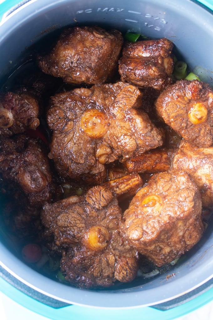 oxtails in insert of instant pot before cooking