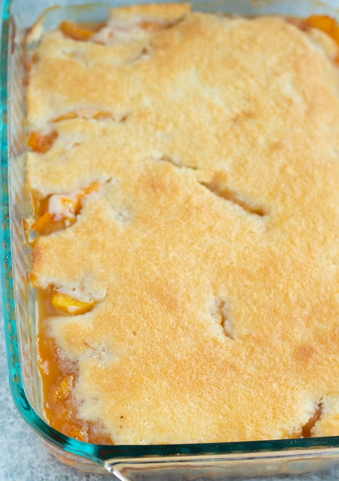 finished southern peach cobbler in baking dish