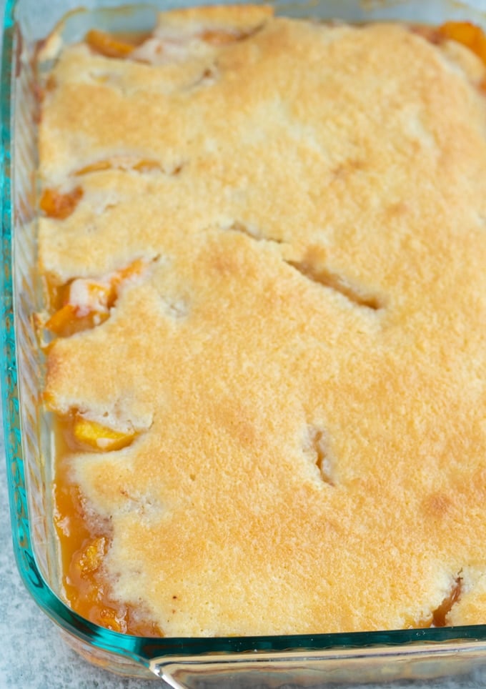 finished southern peach cobbler in baking dish
