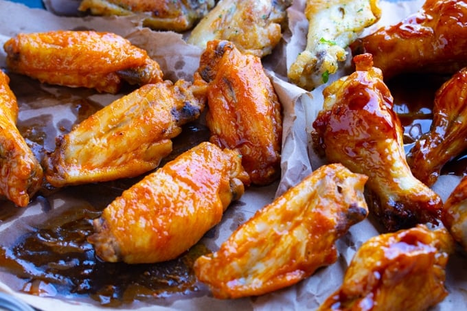 chicken wings in sauce on paper