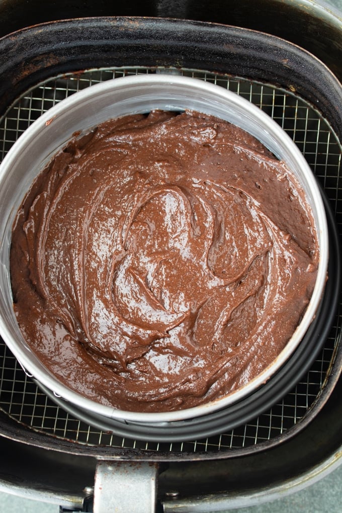 brownie batter in baking pan in air fryer basket