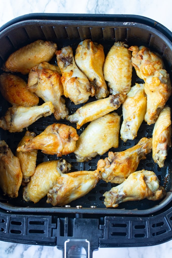 cooked chicken wings in air fryer basket