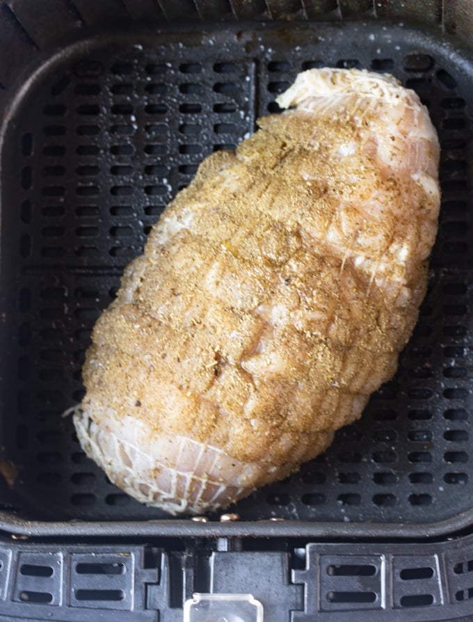 raw boneless turkey breast in air fryer basket