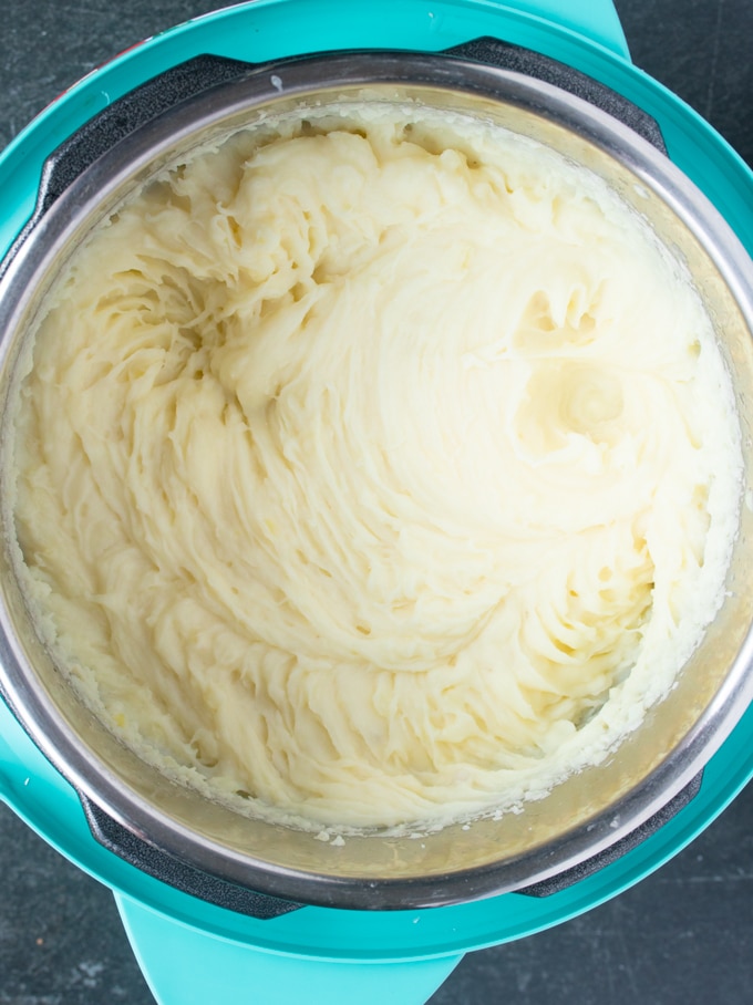 instant pot mashed potatoes that have been mashed inside instant pot insert