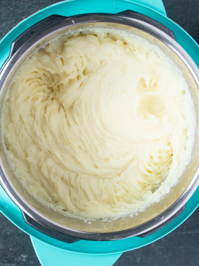 instant pot mashed potatoes that have been mashed inside instant pot insert