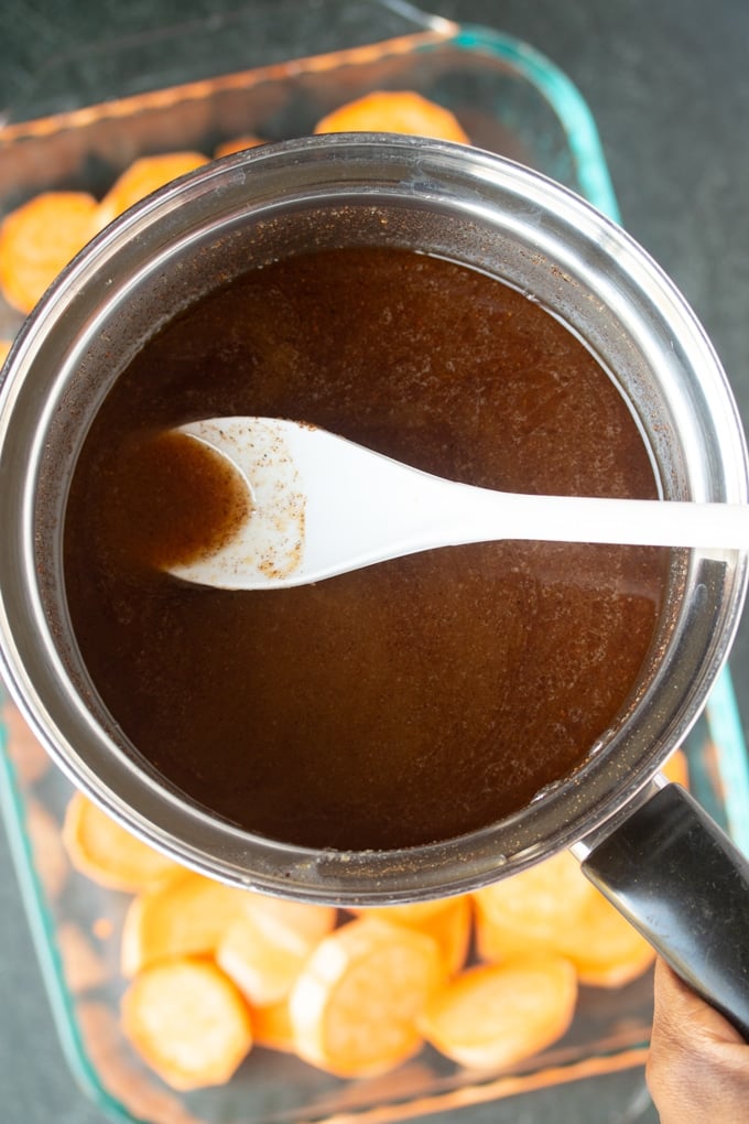 sauce pan with sugar butter mixture with white spoon sticking out