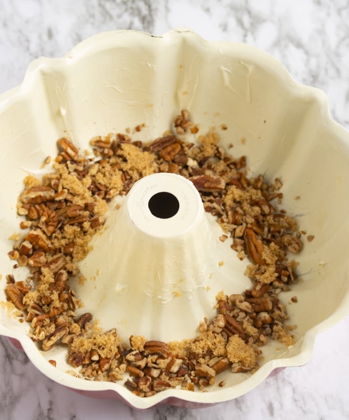 pecans and brown sugar in bottom of bundt pan