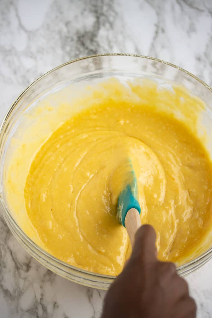 cake batter being stirred in bowl