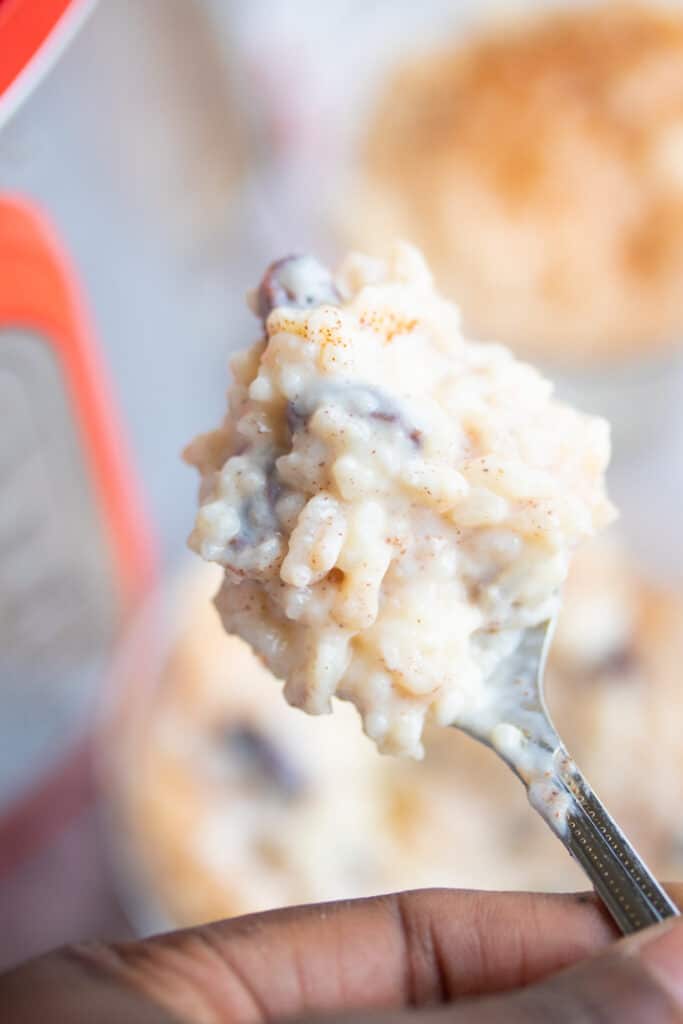 instant pot rice pudding on a spoon