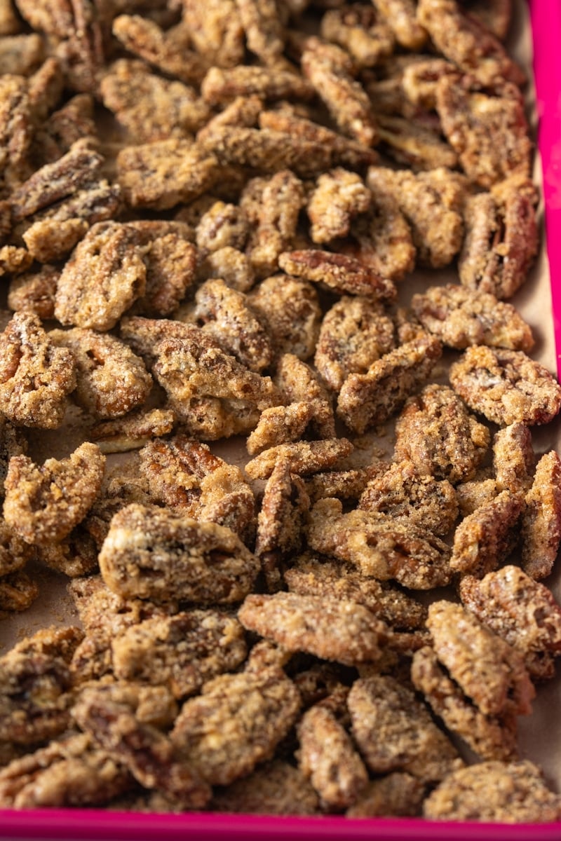 candied pecans on baking sheet cooling