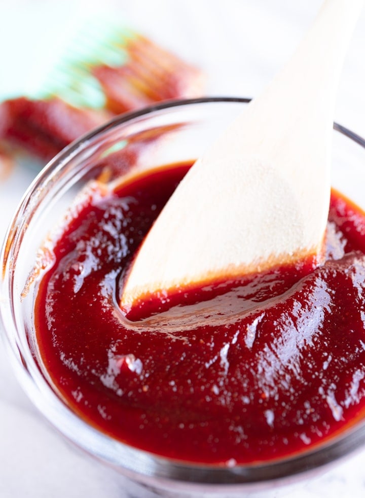 bbq sauce in bowl with spoon in it