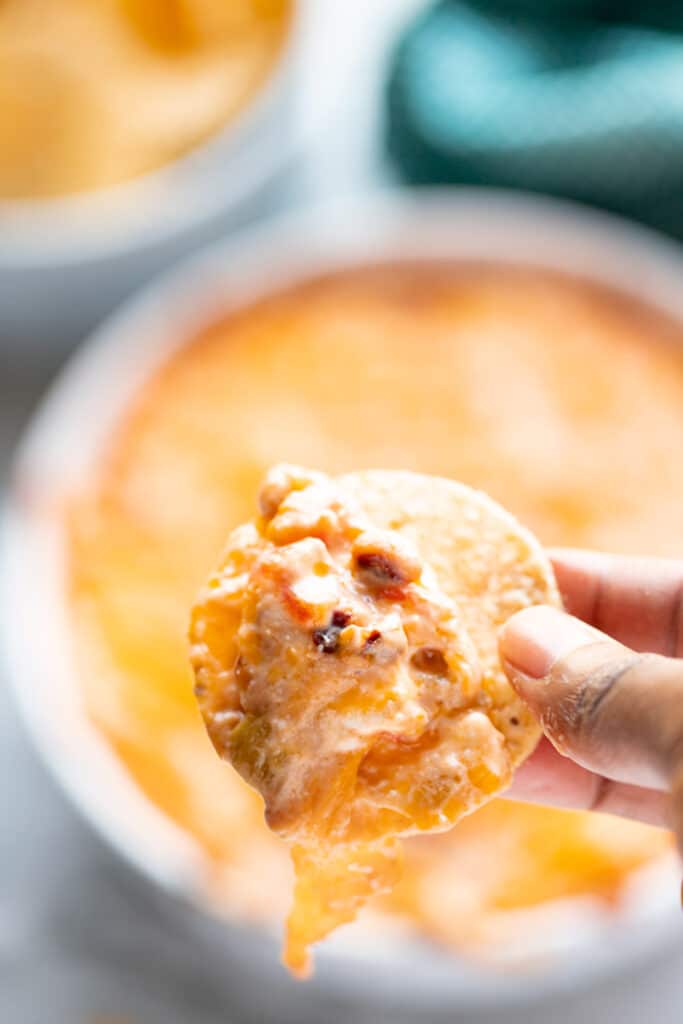 black-eyed pea dip on chip with hand holding it