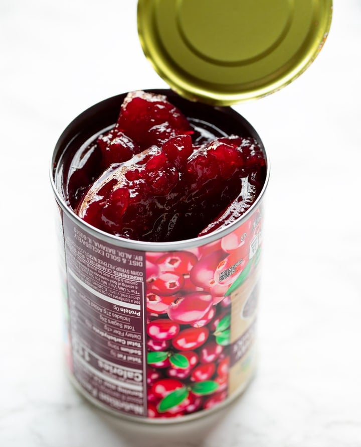 can of cranberry jelly sauce opened with jelly sticking out