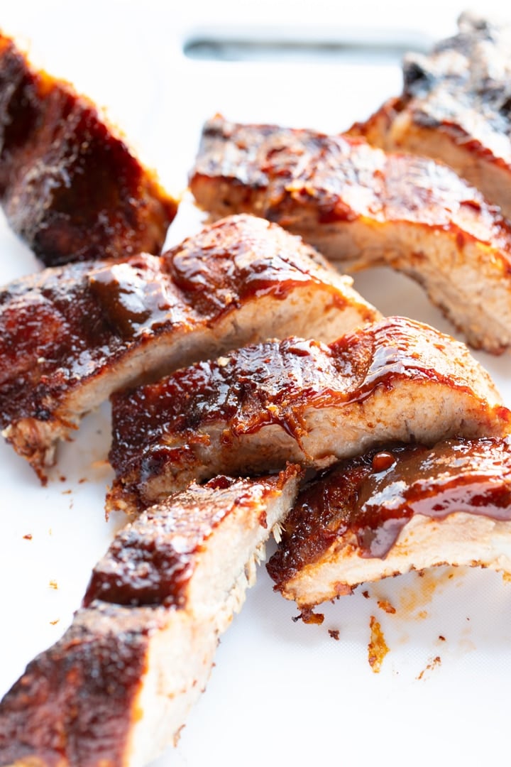 ribs on white cutting board already cut into sections