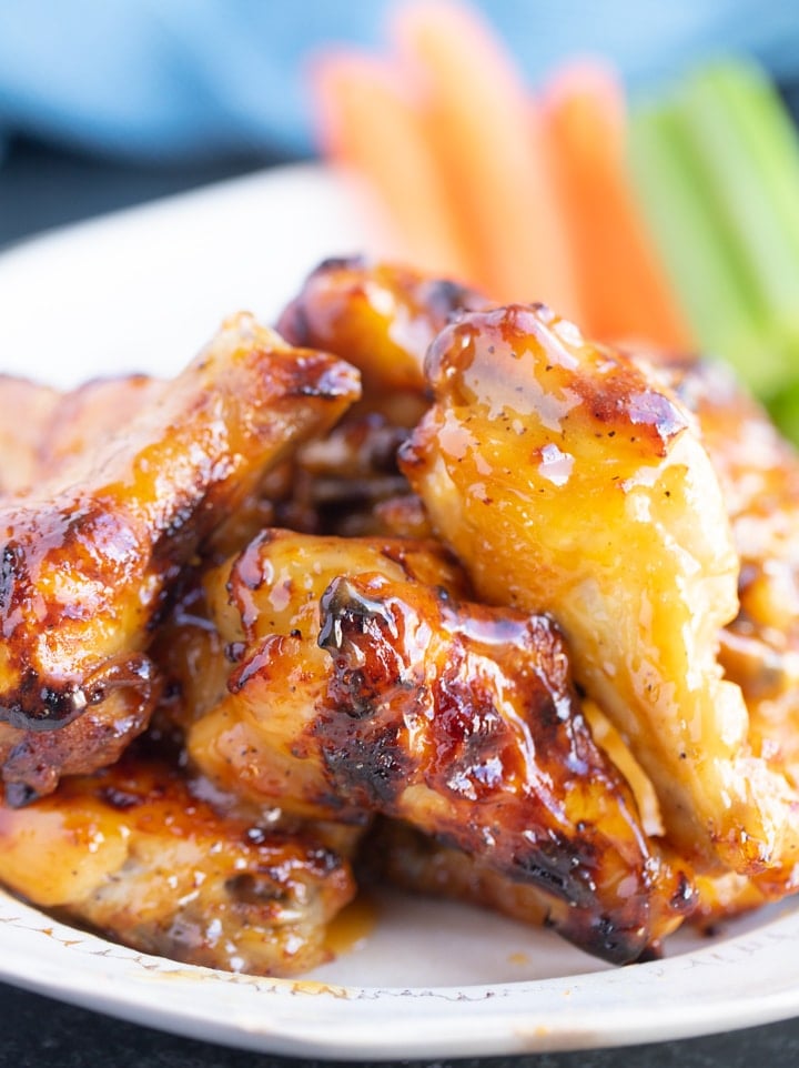 honey mustard wings on a plate, close up photo