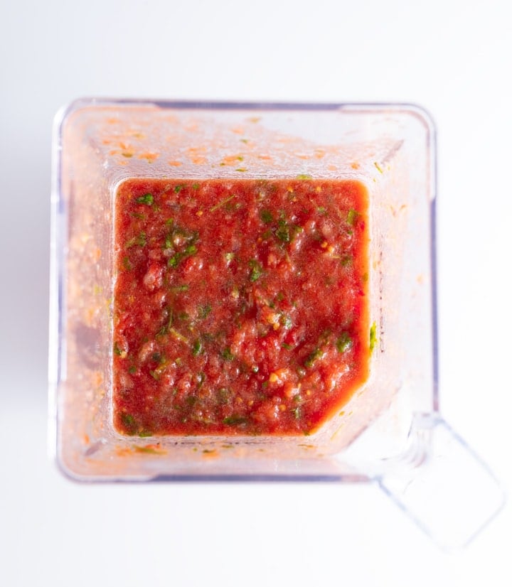 blended salsa ingredients in blender container