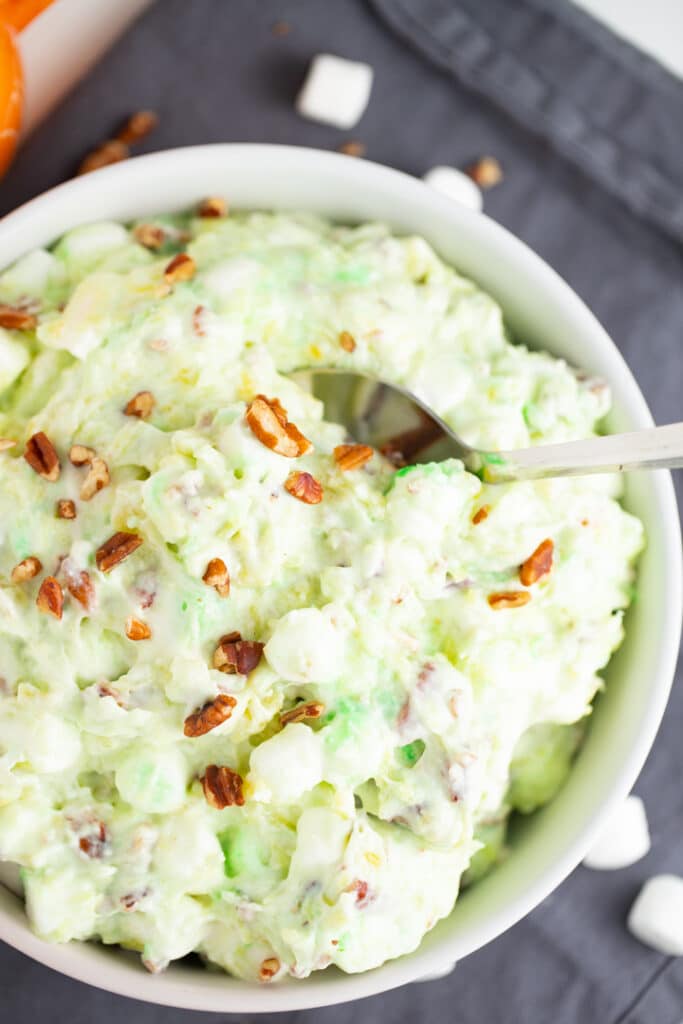 watergate salad in bowl with spoon sticking out