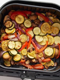 The cooked marinated vegetables in the air fryer basket