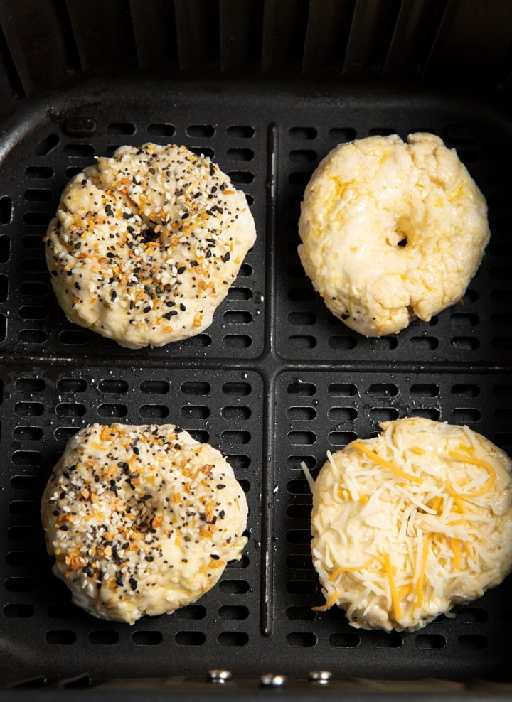 raw bagel in air fryer basket