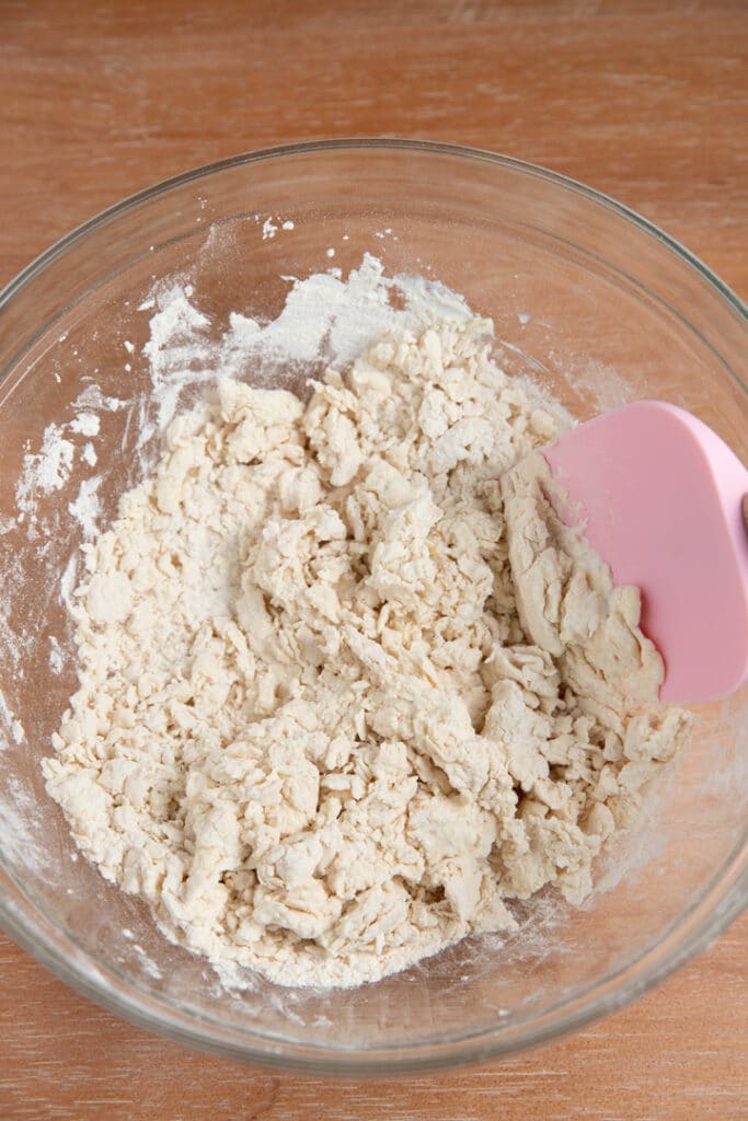 greek yogurt and flour in bowl stirred