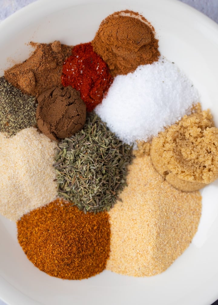 spices and herbs on white plate