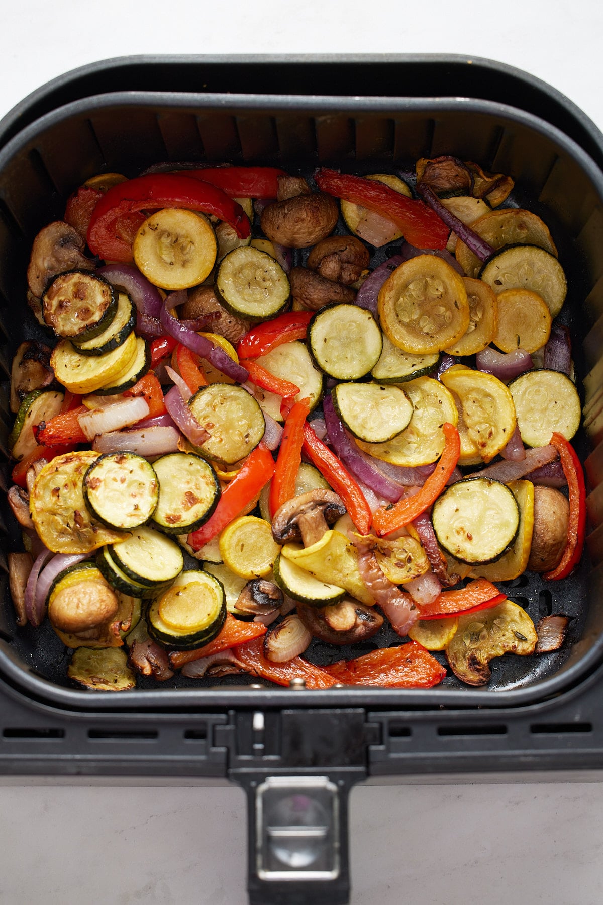 Air fryer vegetables in a white bowl