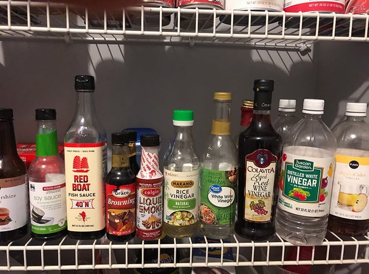 bottlles of vinegars and sauces in pantry