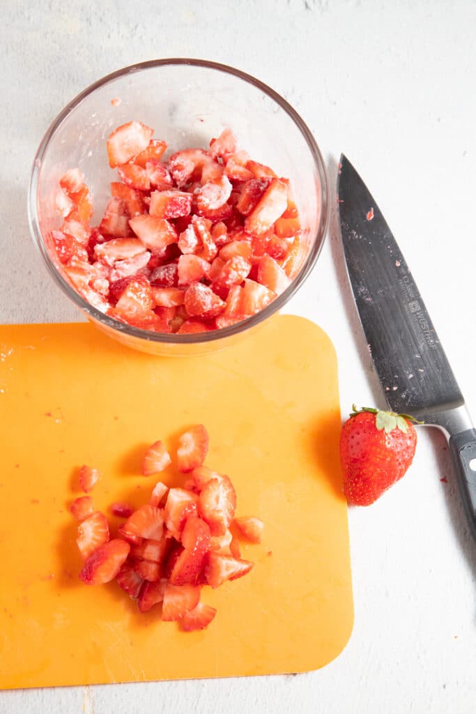 Chopped straberries on a chopping board