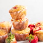 Three strawberry muffins stacked on top of each other