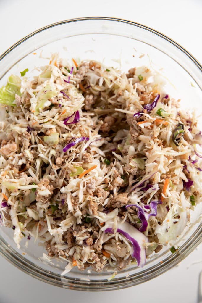 The egg roll ingredinets mixed together in a bowl
