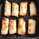 Egg rolls in an air fryer basket