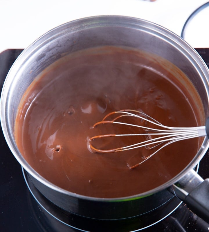 The chocolate pudding being whisked in the pan