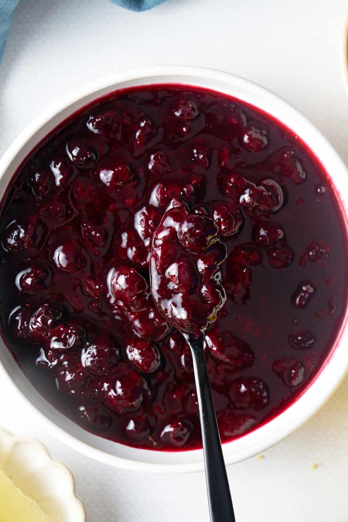 spoon picking up blueberry compote