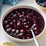blueberry compote with plate with spoon in the middle