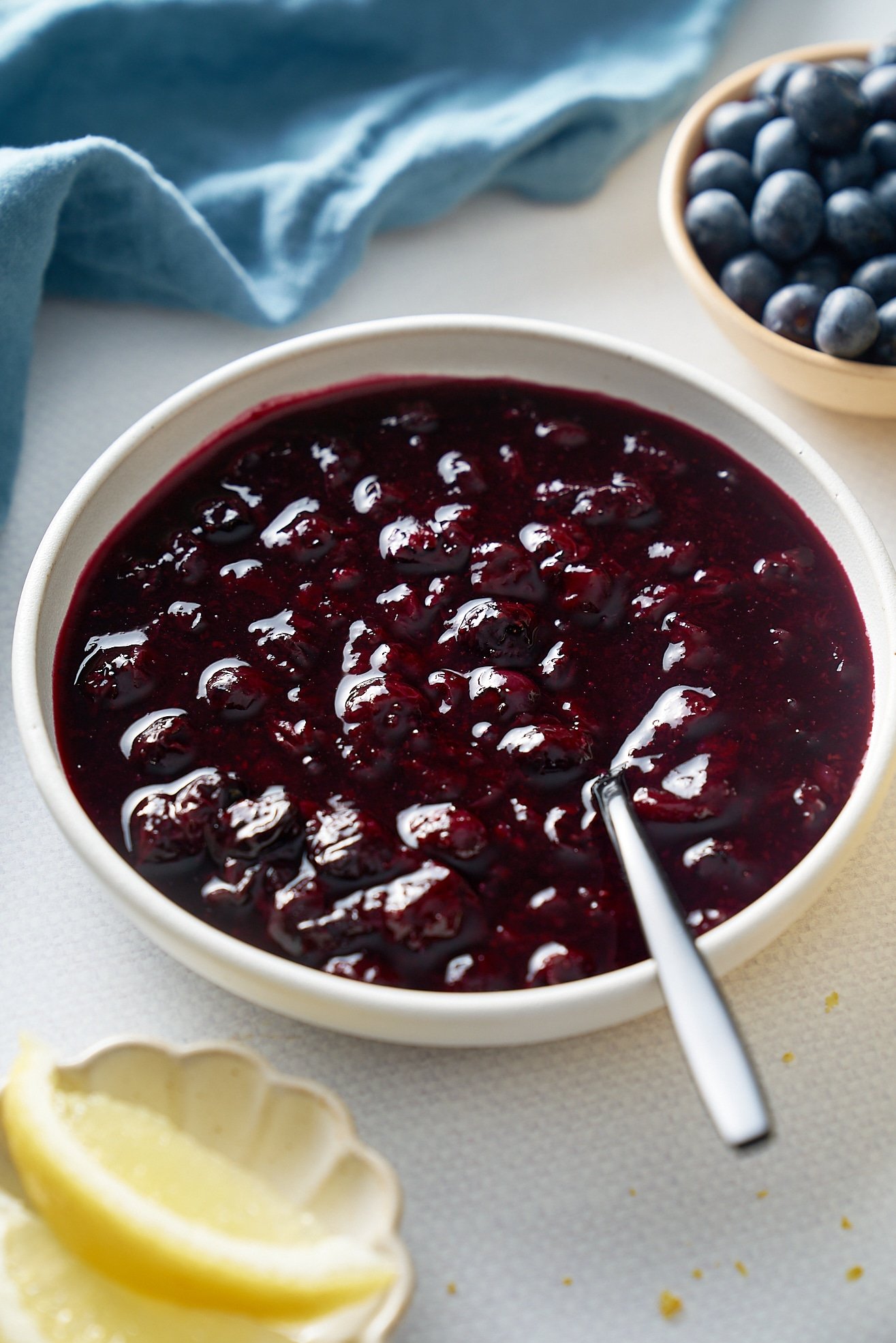 blueberry compote with plate with spoon in the middle