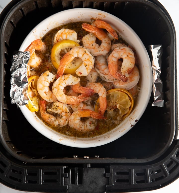 Air fryer lemon shrimp in the basket ready to serve